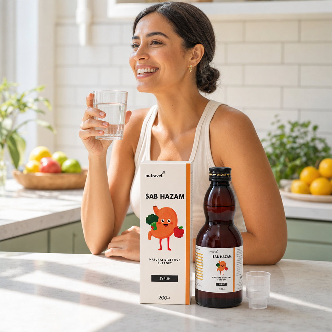 Smiling woman with a glass of water beside Sab Hazam digestive syrup in a kitchen