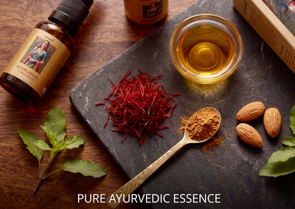 Kumkumadi Tailam bottle with saffron, almonds and a bowl of golden oil