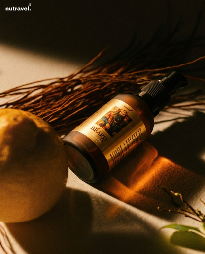Nutravel Beard Oil 30 ml bottle in warm amber light beside dried roots
