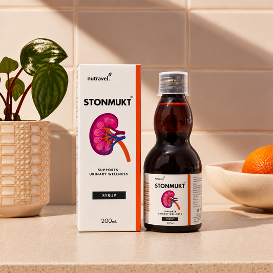 Stonmukt urinary wellness syrup 200 ml bottle and box on a kitchen counter