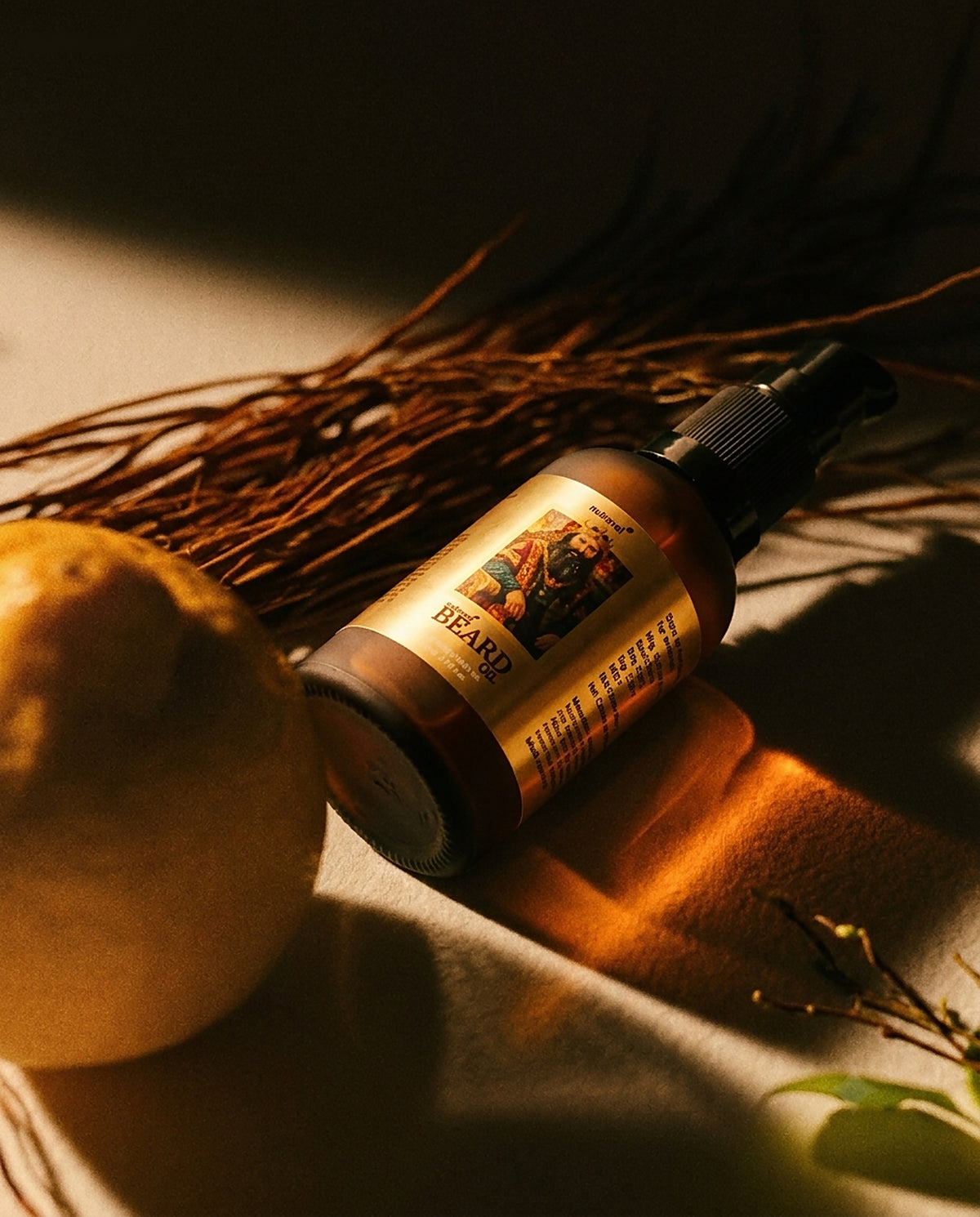 Nutravel Beard Oil 30 ml bottle in warm amber light beside dried roots